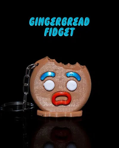 Gingerbread fidget keychain with shocked face and bite mark