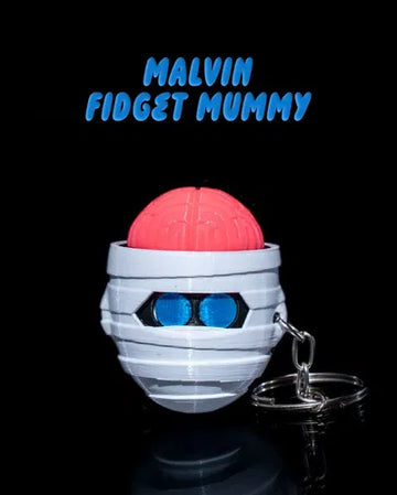 Halloween mummy fidget toy with pink brain and blue glowing eyes