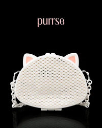 White 3D printed purse shaped like a cat face with pink ear accents and a mesh pattern, featuring a chunky chain strap.