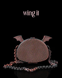 Black 3D printed purse with red undertones and sculpted bat wings, designed with a mesh texture and a gothic aesthetic.