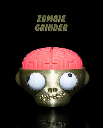 Zombie grinder toy with large red brain and creepy cartoon eyes on black background
