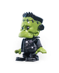 Three-quarter side view of a spooky green monster figurine with spiky black hair and green skin.
