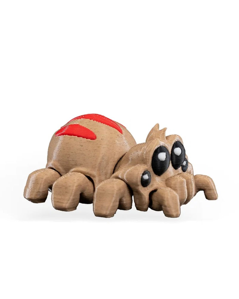 Side view of a tan spider-like monster figure with red back markings, black eyes, and multiple short legs on a white background.